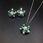 Wholesale floral crystal jewelry set featuring platinum plated copper with fuchsia pink Swarovski element crystals from JuneJewelry.com.