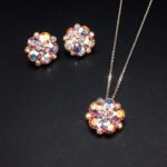 Wholesale floral crystal jewelry set featuring platinum plated copper with fuchsia pink Swarovski element crystals from JuneJewelry.com.