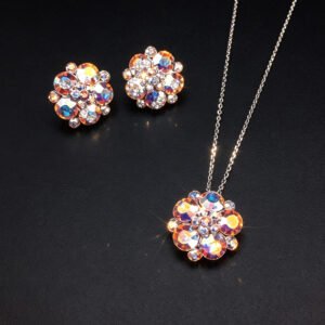 Wholesale floral crystal jewelry set featuring platinum plated copper with fuchsia pink Swarovski element crystals from JuneJewelry.com.