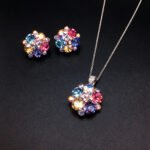 Wholesale floral crystal jewelry set featuring platinum plated copper with fuchsia pink Swarovski element crystals from JuneJewelry.com.