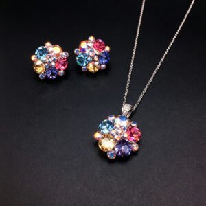 Wholesale floral crystal jewelry set featuring platinum plated copper with fuchsia pink Swarovski element crystals from JuneJewelry.com.