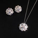 Wholesale floral crystal jewelry set featuring platinum plated copper with fuchsia pink Swarovski element crystals from JuneJewelry.com.
