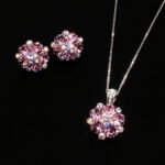 Wholesale floral crystal jewelry set featuring platinum plated copper with fuchsia pink Swarovski element crystals from JuneJewelry.com.
