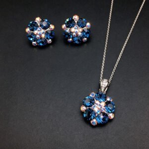 Wholesale floral crystal jewelry set featuring platinum plated copper with fuchsia pink Swarovski element crystals from JuneJewelry.com.