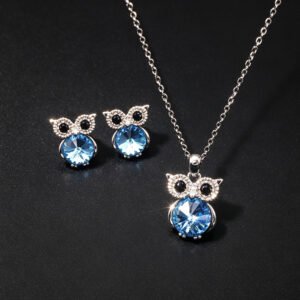 Wholesale owl crystal jewelry set featuring platinum plated copper with blue Swarovski element crystal body and pave zirconia eyes from JuneJewelry.com.