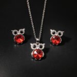 Wholesale owl crystal jewelry set featuring platinum plated copper with blue Swarovski element crystal body and pave zirconia eyes from JuneJewelry.com.