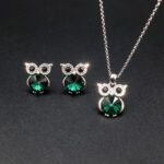 Wholesale owl crystal jewelry set featuring platinum plated copper with blue Swarovski element crystal body and pave zirconia eyes from JuneJewelry.com.