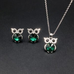 Wholesale owl crystal jewelry set featuring platinum plated copper with blue Swarovski element crystal body and pave zirconia eyes from JuneJewelry.com.