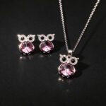 Wholesale owl crystal jewelry set featuring platinum plated copper with blue Swarovski element crystal body and pave zirconia eyes from JuneJewelry.com.