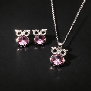 Wholesale owl crystal jewelry set featuring platinum plated copper with blue Swarovski element crystal body and pave zirconia eyes from JuneJewelry.com.