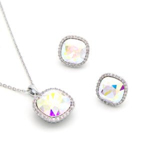 Crystal jewelry set wholesale featuring cushion-cut iridescent Aurora Borealis AB crystal pendant necklace and halo stud earrings on palladium plated copper.