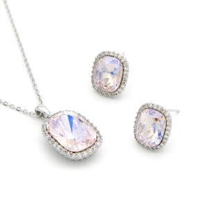 Luxury crystal jewelry set wholesale featuring cushion-cut soft lavender pink crystal pendant necklace and halo stud earrings on palladium plated copper.