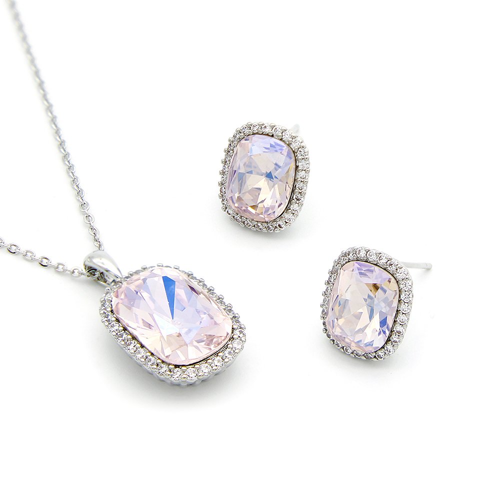 G301299-G100984E01Y.136.A Luxury crystal jewelry set wholesale featuring cushion-cut soft lavender pink crystal pendant necklace and halo stud earrings on palladium plated copper.