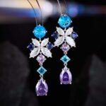 Tear drop CZ floral dangle earrings featuring multi-shaped geometric cubic zirconia, a teardrop crystal pendant, and 925 sterling silver posts