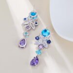 Tear drop CZ floral dangle earrings featuring multi-shaped geometric cubic zirconia, a teardrop crystal pendant, and 925 sterling silver posts
