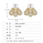 Filigree fan freshwater pearl earrings featuring intricate openwork lace design, central cubic zirconia accents, lustrous cultured pearl stud, and 925 sterling silver ear posts