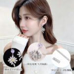 Heart CZ flower drop earrings featuring a heart-cut top gem, micro-paved cubic zirconia flower blossom dangle, yellow center stone, and 925 sterling silver ear posts