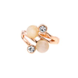 Wholesale bypass cat eye ring in rose gold plated zinc alloy featuring dual round cabochon cat eye stones and bezel-set crystals from JuneJewelry.com.