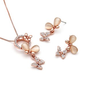Wholesale flying butterfly jewelry set featuring rose gold plated zinc alloy pave charm and cat eye stone pendant with matching drop stud earrings from JuneJewelry.com.