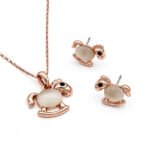 Wholesale rocking horse jewelry set in rose gold plated zinc alloy featuring cat eye stone body pendant necklace and matching stud earrings from JuneJewelry.com.