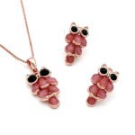 Wholesale wise owl jewelry set in rose gold plated zinc alloy featuring teardrop cat eye stone feathers owl pendant necklace and matching drop earrings from JuneJewelry.com.