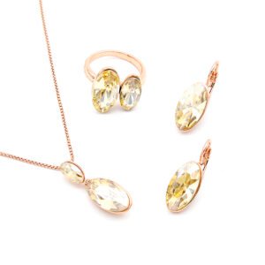 Wholesale oval crystal jewelry set in rose gold plated zinc alloy featuring champagne oval premium crystal pendant, earrings, and ring from JuneJewelry.com.