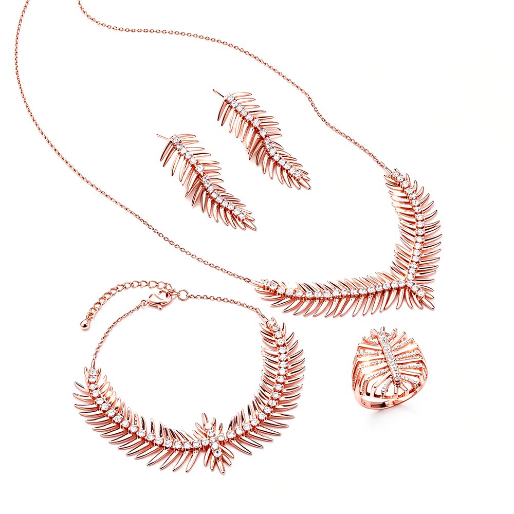 Wholesale feather jewelry set in rose gold plated zinc alloy featuring paved feather pendant necklace, earrings, bracelet, and ring from JuneJewelry.com.