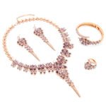 Wholesale leaf crystal jewelry set in rose gold plated copper featuring teal and purple marquise premium crystal necklace, earrings, bangle, and ring from JuneJewelry.com.