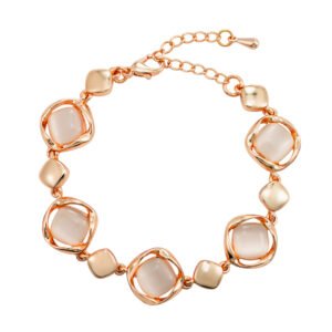 Wholesale geometric cat eye bracelet in rose gold plated zinc alloy featuring framed cushion stones and extension chain from JuneJewelry.com.