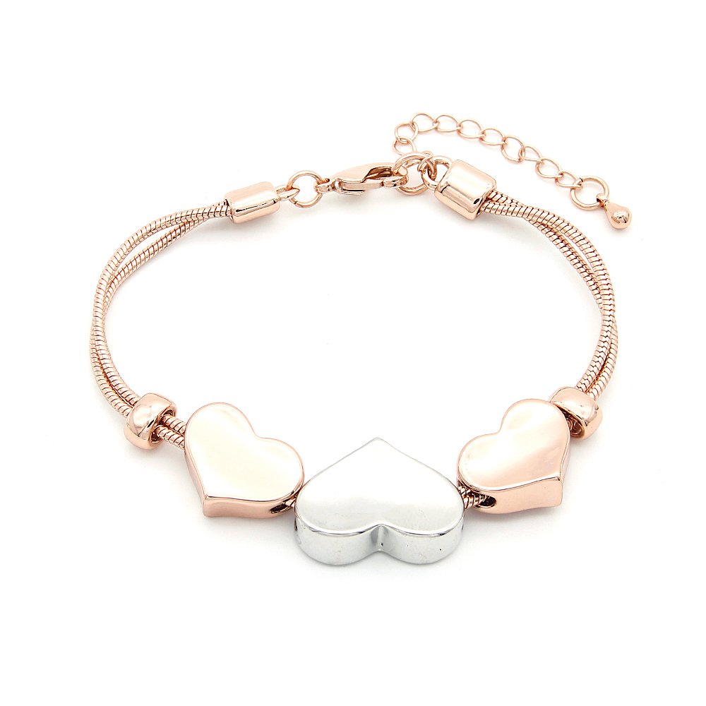 Wholesale heart charm snake bracelet in rose gold plated zinc alloy featuring double snake chain and two-tone sliding hearts from JuneJewelry.com.