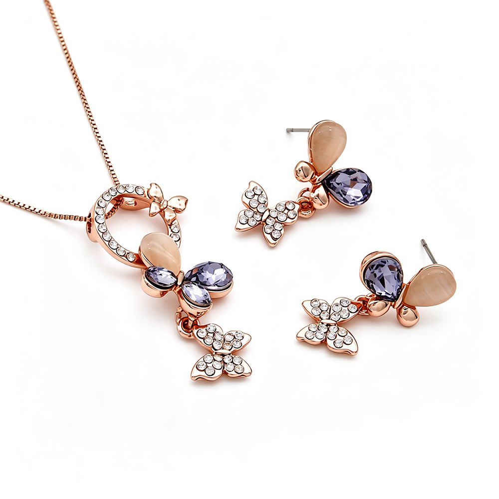 Wholesale crystal butterfly jewelry set in rose gold plated zinc alloy with purple faceted crystals and cat eye stones from JuneJewelry.com.