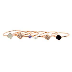 Wholesale clover band ring set in rose gold plated zinc alloy featuring six thin bands with cat eye stone, pearl, purple crystal, and clover charms from JuneJewelry.com.
