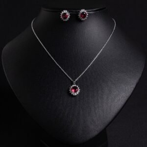 Niche sunburst baguette zircon jewelry set wholesale featuring an oval gemstone surrounded by a sunburst halo of baguette and round cubic zirconia with matching stud earrings from junejewelry.com