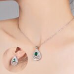 Niche layered teardrop jewelry set wholesale featuring a multi-layer hollow pave cubic zirconia teardrop pendant necklace with matching stud earrings from junejewelry.com