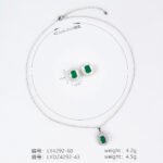 Niche emerald cut halo zircon jewelry set wholesale featuring an octagon emerald-cut gemstone surrounded by a baguette cubic zirconia halo with matching stud earrings from junejewelry.com