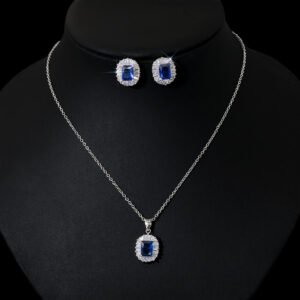 Niche emerald cut halo zircon jewelry set wholesale featuring an octagon emerald-cut gemstone surrounded by a baguette cubic zirconia halo with matching stud earrings from junejewelry.com