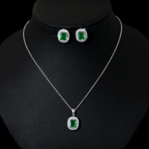 Niche emerald cut halo zircon jewelry set wholesale featuring an octagon emerald-cut gemstone surrounded by a baguette cubic zirconia halo with matching stud earrings from junejewelry.com