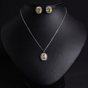 Niche emerald cut halo zircon jewelry set wholesale featuring an octagon emerald-cut gemstone surrounded by a baguette cubic zirconia halo with matching stud earrings from junejewelry.com