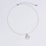 Niche textured pearl flower jewelry set wholesale featuring a lustrous central synthetic pearl nestled within textured, pave-set cubic zirconia flower petals with matching stud earrings from junejewelry.com