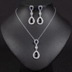 Niche double teardrop drop zircon jewelry set wholesale featuring a two-tier teardrop crystal pendant linked by marquise zircons with matching dangle earrings from junejewelry.com