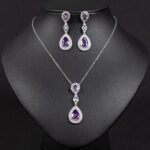 Niche double teardrop drop zircon jewelry set wholesale featuring a two-tier teardrop crystal pendant linked by marquise zircons with matching dangle earrings from junejewelry.com