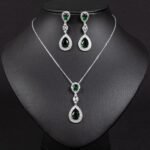 Niche double teardrop drop zircon jewelry set wholesale featuring a two-tier teardrop crystal pendant linked by marquise zircons with matching dangle earrings from junejewelry.com