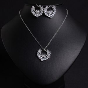 Niche hollow heart crystal jewelry set wholesale featuring an openwork marquise cubic zirconia heart wreath pendant necklace and matching heart earrings from junejewelry.com