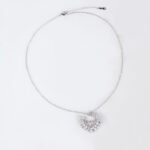 Niche hollow heart crystal jewelry set wholesale featuring an openwork marquise cubic zirconia heart wreath pendant necklace and matching heart earrings from junejewelry.com