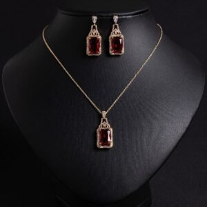 Niche emerald cut zircon halo jewelry set wholesale featuring a rectangular emerald-cut main gem inside an intricate pave cubic zirconia filigree frame with matching drop earrings from junejewelry.com