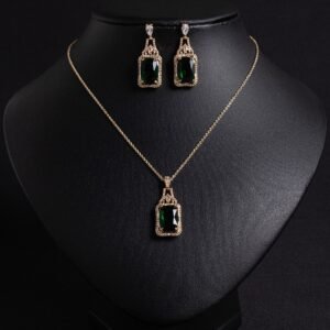 Niche emerald cut zircon halo jewelry set wholesale featuring a rectangular emerald-cut main gem inside an intricate pave cubic zirconia filigree frame with matching drop earrings from junejewelry.com