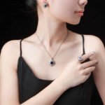 Niche snowflake crystal jewelry set wholesale featuring a central round gemstone surrounded by a cluster of marquise CZ crystals with matching stud earrings and ring from junejewelry.com