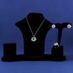 Niche snowflake crystal jewelry set wholesale featuring a central round gemstone surrounded by a cluster of marquise CZ crystals with matching stud earrings and ring from junejewelry.com