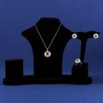 Niche snowflake crystal jewelry set wholesale featuring a central round gemstone surrounded by a cluster of marquise CZ crystals with matching stud earrings and ring from junejewelry.com