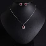Niche square halo zircon jewelry set wholesale featuring a cushion-cut center gem enclosed by a pave cubic zirconia halo with matching stud earrings from junejewelry.com